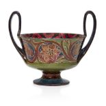 William Moorcroft (1872-1945), a twin-handled ceramic bowl with red lustre c.1910, signed in green W