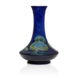 William Moorcroft (1872-1945), a Moonlit Blue pattern ceramic vase c.1925, signed W Moorcroft,