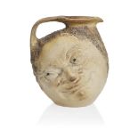 R.W. Martin (1843-1923), a large Martin Brothers stoneware salt-glazed Double ‘Face’ jug c.1890,