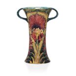 William Moorcroft (1872-1945), a Chrysanthemum pattern twin handled ceramic vase c.1912, signed in