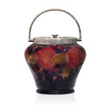 William Moorcroft (1872-1945), a Pomegranate pattern biscuit barrel with plated cover c.1920, signed