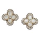 A pair of mother-of-pearl and diamond cluster earstuds, each carved mother-of-pearl quatrefoil