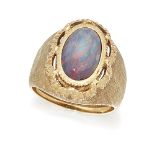 An opal ring by Buccellati, the central oval black opal within a scalloped surround to a textured