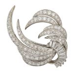 A diamond brooch, of circular and single-cut diamond scrolling spray design with tapered baguette-