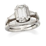 A diamond ring, composed of conjoined hoops, one with cut-cornered rectangular diamond single single