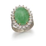 A jadeite jade and diamond cluster ring, the oval jade cabochon within a brilliant-cut diamond