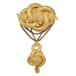 A mid 19th century gold brooch, the scrolling quatrefoil top with graduated boss accents and applied