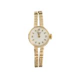 A lady's 9ct gold manual wind wristwatch, by Longines, the circular white dial with applied numerals