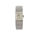 A 9ct white gold and diamond wristwatch, by Record, the silvered square dial with applied baton