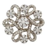 A diamond brooch, of single-cut diamond looped hexafoil design set with a series of brilliant-cut