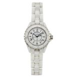 A stainless steel and white ceramic ‘J12’ quartz wristwatch, by Chanel, the circular white dial with