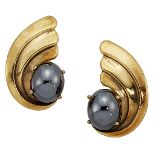 A pair of 9ct gold and hematite earclips by Deakin & Francis, each scroll motif panel with single