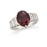 A platinum, ruby and diamond ring, the single claw-set oval-cut ruby with baguette diamond three