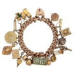A charm bracelet, the curb link bracelet suspending a series of charms including: a 9ct gold