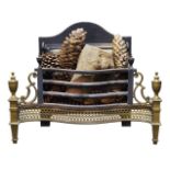 A George III style brass and iron serpentine fire grate, with urn finials, the front with shaped