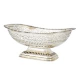 A large silver dish with pierced border, Sheffield, c.1928, James Deakin & Sons., raised on a