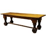 A large oak refectory table, 19th century, the triple plank top, with cleated ends, on turned