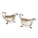 A pair of George III silver sauce boats, London c.1762, Fuller White, each raised on three shell-