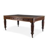 A Regency mahogany writing table, the rounded rectangular top inset with green leather writing