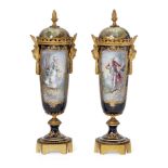 A pair of French porcelain and gilt metal mounted vases, late 19th century, the lids with acorn