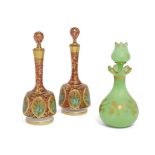 A pair of Continental glass bottles and stoppers, 19th century, decorated with panels of bulrushes