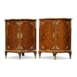 A pair of Louis XV serpentine kingwood, parquetry and ormolu mounted encoignures, mid 18th