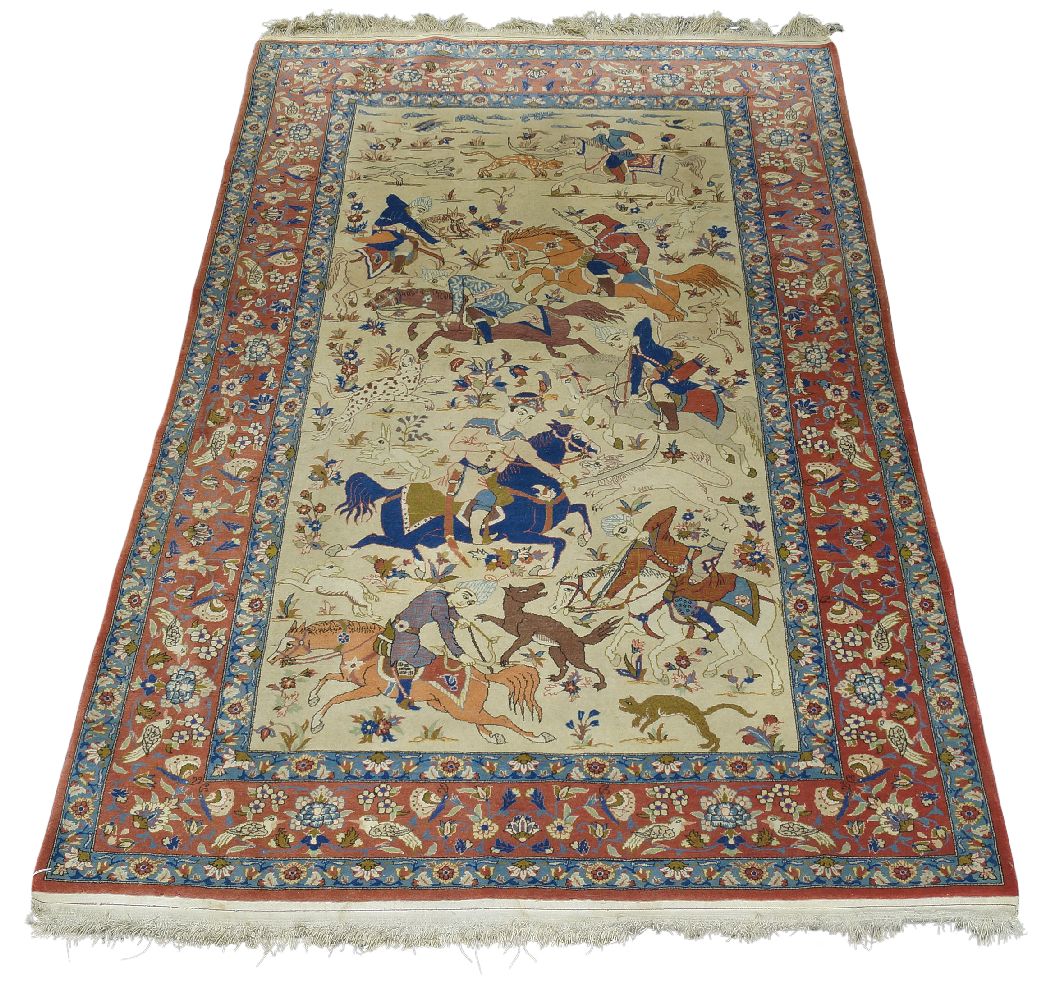 A Kashan hunting rug, mid/late 20th Century, with huntsman on horseback chasing wild beasts, 233cm x