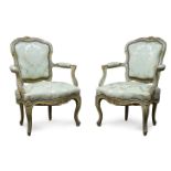 A pair of Louis XV style grey painted fauteuils, 19th Century, the cartouche shaped backrest with