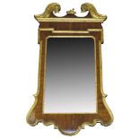 A George II style mahogany and parcel gilt wall mirror,19th Century, the swan neck pediment with