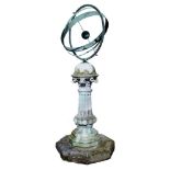 A green patinated bronze Armillary sphere, parts late 19th/ 20th century, mounted on a Portland