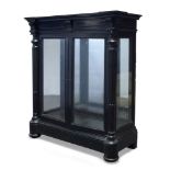 A Victorian ebonised pier cabinet, the inverse breakfront top above single frieze drawer, over two