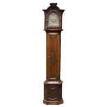 A French oak long case clock, 18th /19th Century, the arching hood with carved basket of flowers,