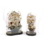 A Victorian silk flower arrangement, in a glass bead vase, under a large glass dome, with an