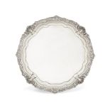 An Edwardian silver salver, London, c.1901, Harrison Brothers and Howson, raised on four scroll