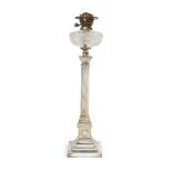 A Victorian silver-plated oil lamp, with brass burner fittings above a glass reservoir, the column