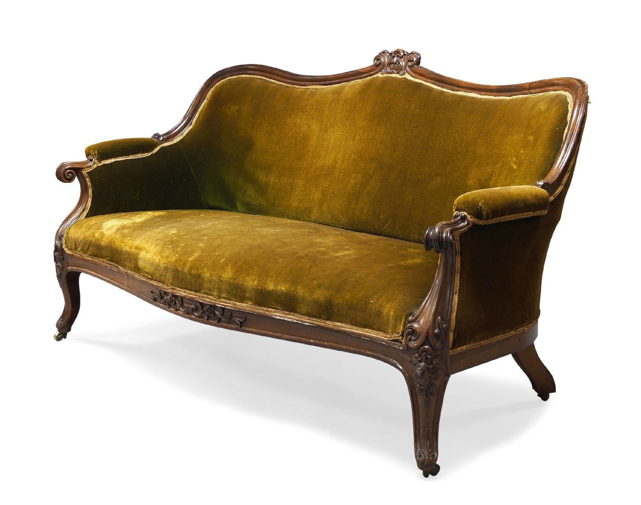 A William IV rosewood framed sofa, the serpentine top rail centred by carved scrolling foliate and