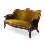 A William IV rosewood framed sofa, the serpentine top rail centred by carved scrolling foliate and