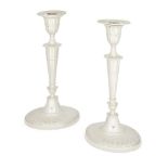 A pair of Victorian silver candlesticks, London, c.1890, William Hutton & Sons., each raised on a