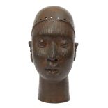 A bronze female head, Yoruba, in the 14th century style, 20th century, her face carved with