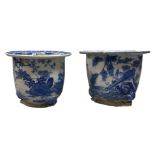 A near pair of Japanese blue and white jardinières, 20th century, decorated with landscapes of