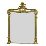 A large Victorian carved giltwood overmantle mirror, of rectangular form with pierced and carved