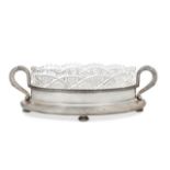 A Russian cut glass dish raised on a silver stand, by Faberge, the navette-shaped cut glass dish,