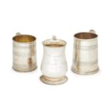 Three silver tankards, two with reeded decoration, one London, c.1811, maker's marks rubbed, the