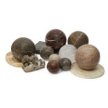A collection of four specimen marble spheres, of recent date, 19cm diameter, with a smaller rock