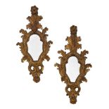A pair of Italian giltwood and gesso girandole mirrors,18th Century, with foliate and flowerhead