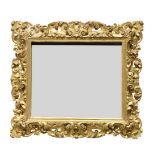 A Continental carved giltwood mirror, 19th century and later, of rectangular form, the pierced frame