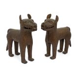 A pair of Nigerian Benin bronze leopards, 20th century, modelled standing, 30cm highPlease refer