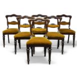 A set of six Victorian mahogany dining chairs, the shaped open backs with carved and padded