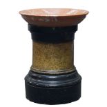 A cylindrical pottery pedestal, 19th century, with black capitals, the shaft decorated to imitate