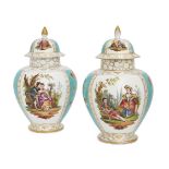 A pair of German Dresden porcelain vases and covers, late 19th/early 20th century, decorated with